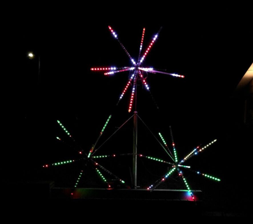 The Fireworks Tree, three LED spheres mounted on a trunk, in the front yard